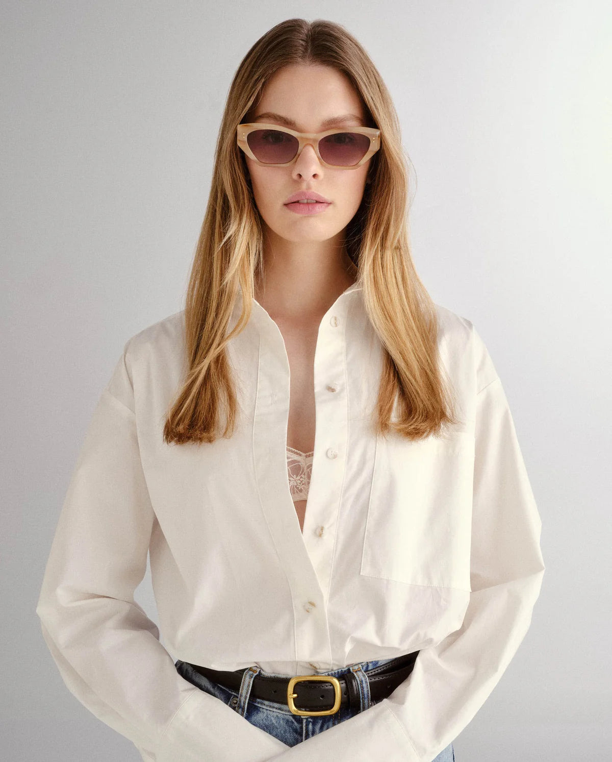 Woman wearing luv lou sunglasses shop at Studio Row