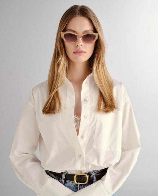 Woman wearing luv lou sunglasses shop at Studio Row