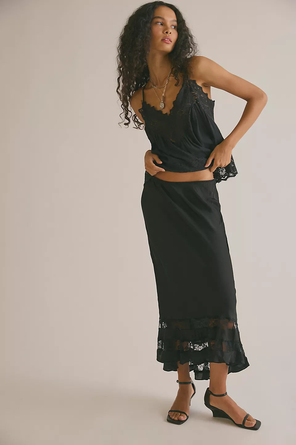 Long Lost Lover Maxi Slip Skirt in Black — silky high-rise slip skirt with lace inlays and a ruffle hem
