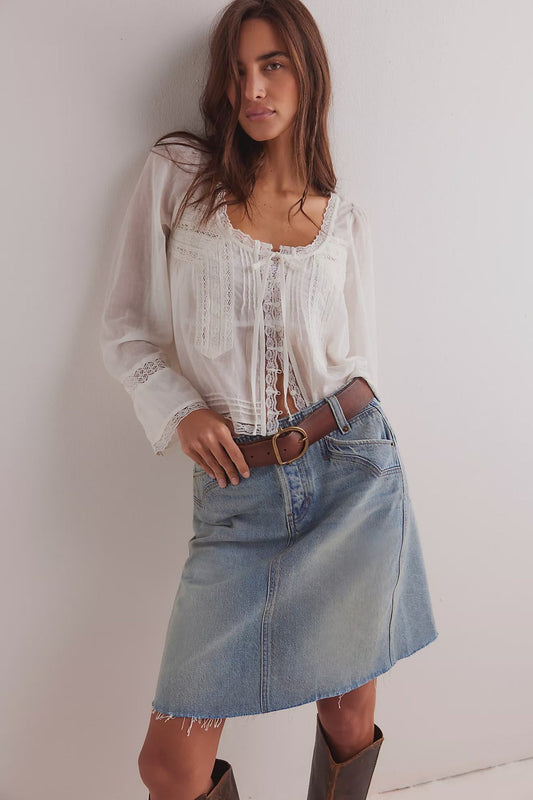 Women’s light washed denim midi skirt by Free people, with frayed raw edge
